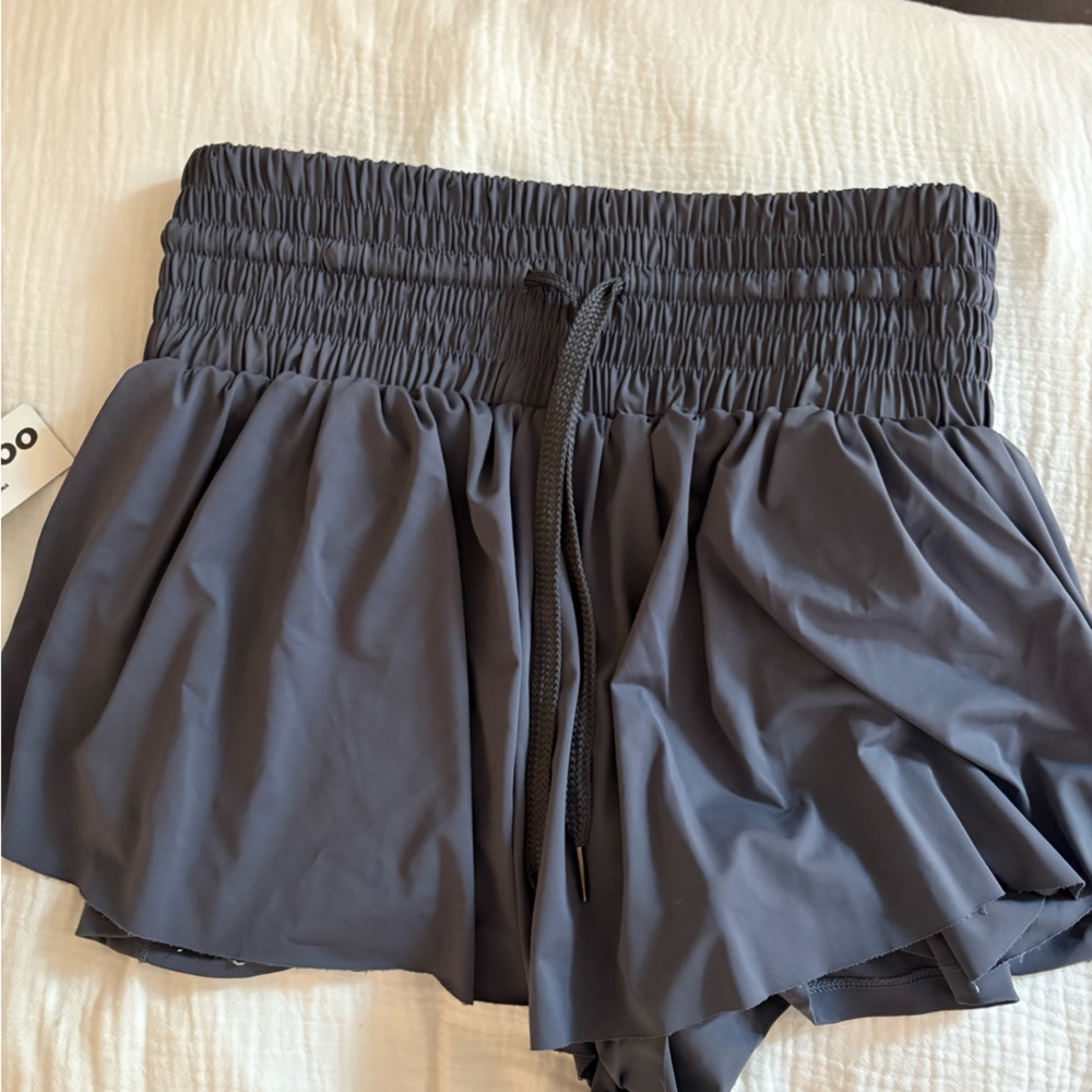 Dark gray athletic running shorts.